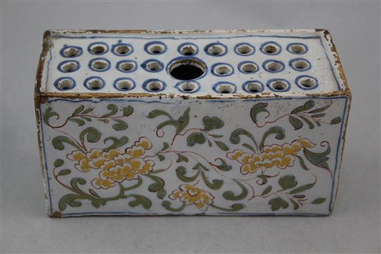 An English delftware polychrome flower brick, c.1760, possibly Liverpool, 17.5cm.